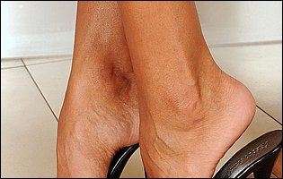 Pretty brunette Ashley Bulgari showing off her sexy feet