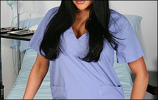 Hot nurse Audrey Bitoni in black stockings and heels poses for camera