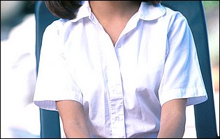 Jenna Haze in school uniform strips for camera