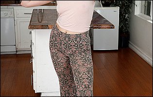 Adira Allure exposing nude body and spreading her pussy in kitchen
