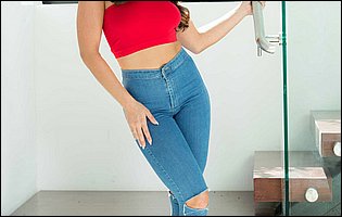 Adriana Chechik in sexy jeans and red heels posing for camera