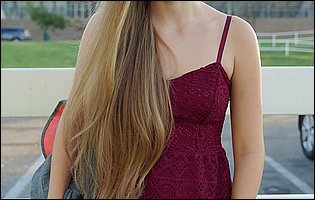 Young cutie Alyce Anderson in sexy dress poses outdoor