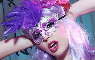 Kinky mistress Anastasia Pierce in sexy mask playing with a dildo
