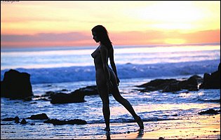 Ann Marie Rios posing on the beach