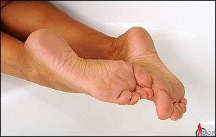 Ashley Bulgari showing off her nice feet in the bathroom