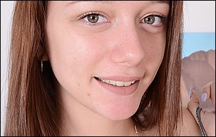 Avery Stone strips off her black leather top and presents nude body