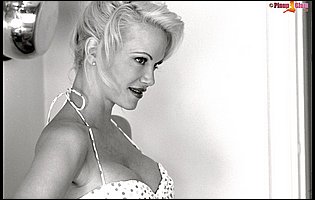 Beautiful busty blonde Barbara Moore posing for camera