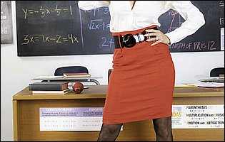 Professor Brandi Love in sexy black stockings posing in classroom