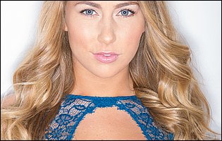 Carter Cruise posing in blue lingerie, stockings and black heels