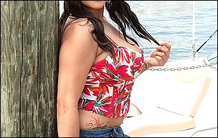 Busty cutie Cat Bangles in sexy outfit poses outdoor
