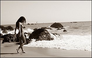 Charmane Star exposing her body on the beach