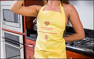 Beautiful housewife Christiana Cinn posing in the kitchen