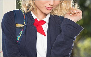 Dakota Skye in school uniform strips outdoor