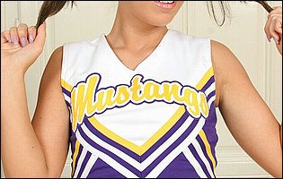 Cute cheerleader Debbie White stripping and posing for camera