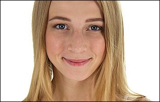 Elizabeth Evans in pink top and socks likes posing for camera