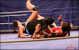 Wrestling match between Emma Butt, Diana Stewart and Larissa Dee