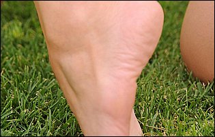 Lovely beauty Eufrat posing and showing off her nice feet outdoor