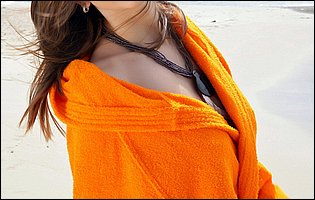 Gorgeous young brunette Eufrat exposes her sexy body on the beach