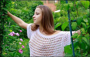 Young cutie Eva Shanti posing for your pleasure in the garden