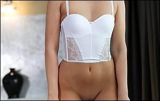 Eva Strauss in white lingerie strips and shows her sexy naked body