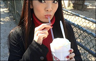Cute busty asian babe Hitomi Tanaka poses for you outdoor