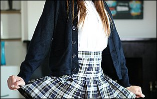 Beautiful schoolgirl Jade Nile strips for camera