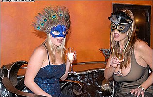 Jamie Brooks and Kelly Madison in sexy costumes posing for camera
