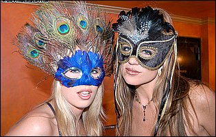 Jamie Brooks and Kelly Madison in sexy costumes posing for camera