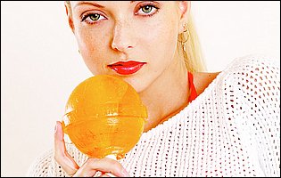 Sexy blonde Jana Cova playing with a big lollipop