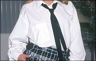 Jeanie Rivers in school uniform strips for camera