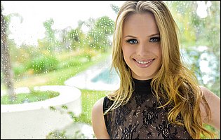Cute blonde Jillian Brookes posing in sexy black lingerie