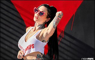 Joanna Angel in sexy top and red panties likes teasing.