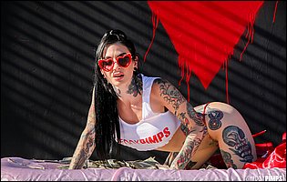 Joanna Angel in sexy top and red panties likes teasing