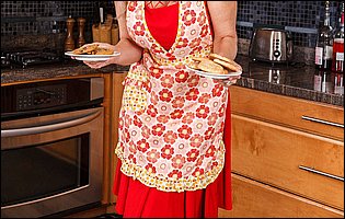 Beautiful housewife Julia Ann stripping and posing in the kitchen