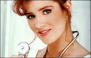 Cute nurse Julia Hayes posing for camera