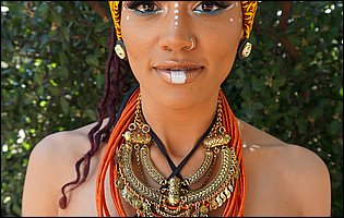 Busty exotic beauty Julie Kay poses outdoor