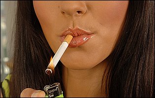 Katerina Nova smoking a cigarette and fucking her pussy with a dildo