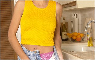 Young beauty Kelly Kline stripping in the kitchen