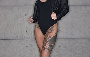 Gorgeous blonde Kleio Valentien displaying her tattooed body