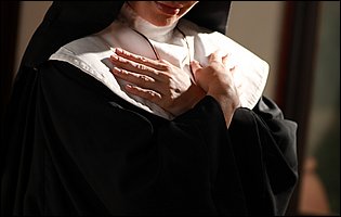 Sexy nun Lea Lexus strips for camera