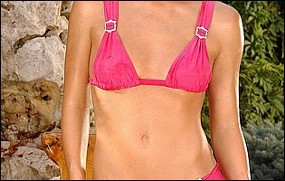Bikini girl Linda James fucks her pussy with a dildo in the garden