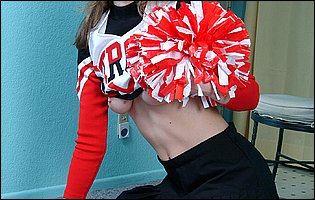 Beautiful cheerleader Lisa Marie stripping for camera