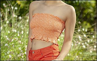 Cute teen Liv Wild strips off her sexy top and red shorts outdoor