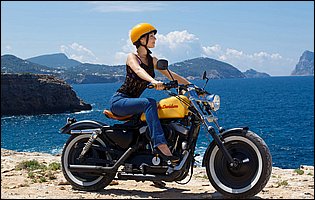 Lorena Garcia posing with a motorcycle