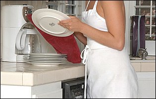 Sexy brunette Louisa Lanewood posing in the kitchen