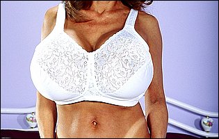 Asian MILF Minka shows off her huge boobs and plays with red dildo
