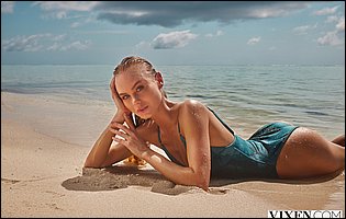 Nancy A exposing tight body on the beach.