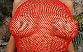 Regina Ice in red fishnet showing her body and fucking her pussy