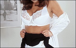 Beautiful busty secretary Renee Fern strips in the office