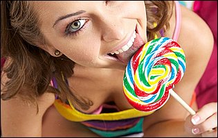 Young cutie Riley Reid playing with lollipop